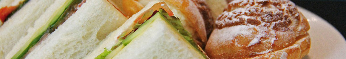 Eating Deli Sandwich at Boda's Kitchen restaurant in Hood River, OR.